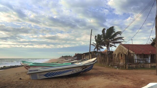 Fishing boats and canoes in Sri Lankan Beach side Sea shore 

