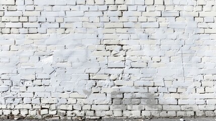Physical inscription in black on white brick wall