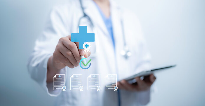 A medical worker with virtual Quality Certificate handling many checklist documents for quality control management standardization and certification compliance to standards.