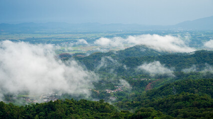 Beautiful Mountain landscape foggy windy mountain range green landscape asian farm. Amazing Landscape mountain green field meadow white cloud blue sky on sunrise. Countryside sunlight heaven scenery