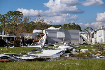 Aftermath of natural disaster in southern Florida. Badly damaged mobile homes after hurricane swept through residential area