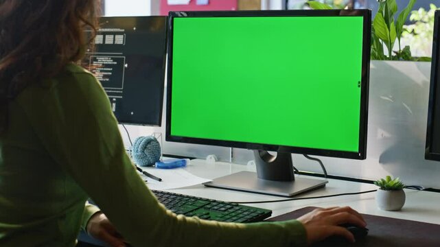 Employee watching greenscreen computer workplace closeup. Businesswoman working
