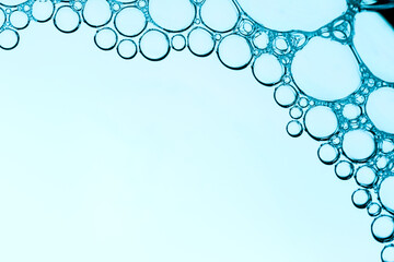 Bubbles in water close-up. Abstract blue background.