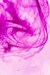 abstract background of pink and purple ink splashing on white background