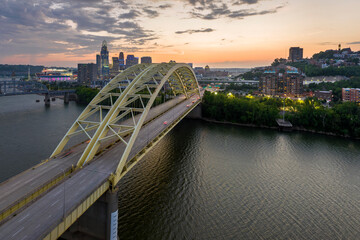 Cincinnati, Ohio with driving cars on Daniel Carter Beard Bridge highway near illuminated high...