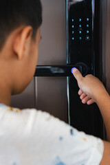 child opening door with fingerprint in smart lock system