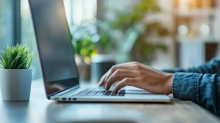 A person working with a desktop computer, comfortably seated in a modern chair, soft background