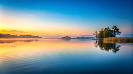 Obraz premium Tranquil lake scene at dawn with minimalist