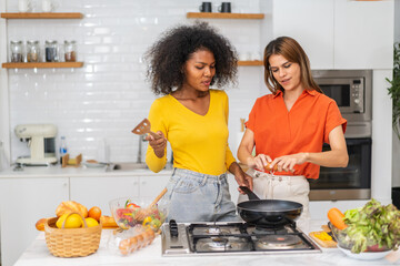 Diversity young happy love LGBT, LGBTQ caucasian and african family lesbian couple woman felling relaxing and enjoy time at home, friend, pride, rainbow.Lgbt lesbian couple