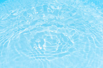 Blue water with ripples on the surface. Defocus blurred transparent blue colored clear calm water...