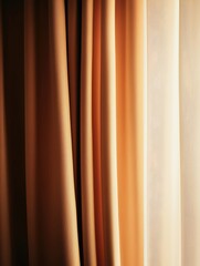 Fototapeta premium Close-up of soft, beige and cream curtains with gentle lighting, evoking a calm and warm atmosphere in indoor settings.