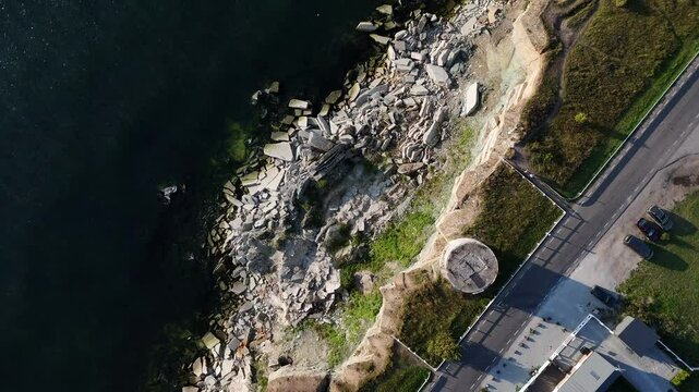 Top-down aerial view of Pakri Cliff in Paldiski, Estonia near Tallinn, captured during a sunny evening showcasing dramatic coastal formations.