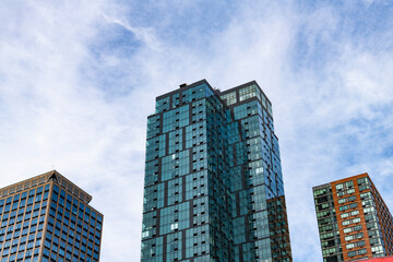 Fototapeta premium Modern skyscraper building. Architectural building in metropolis. Skyscraper perspective view. City architecture. Architecture of modern office building. Perspective city skyscraper. Urban building