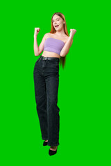 Young Woman Flexing Bicep Against Green Screen