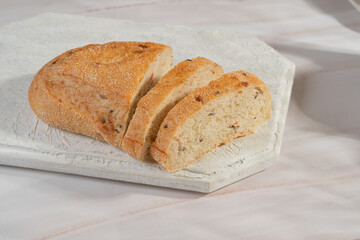 White sliced ​​bread lies on a light background