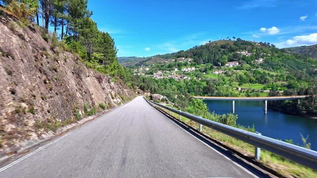 Driving with the car through the Peneda Geres National Park in Portugal, Europe. Area betweeen Cabril und Ruivaes