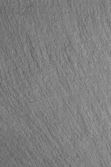 Close-up of a grey natural slate background backdrop. Natural material used in the construction industry
