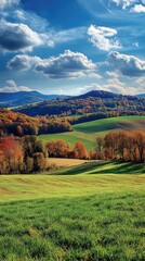 Fototapeta premium A picturesque autumn landscape with rolling hills and a brilliant blue sky.