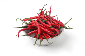 A bowl overflowing with vibrant red chili peppers, Isolated on a white background