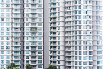Close up view on the residential building, repeating objects - windows and balconies. Abstract pattern.