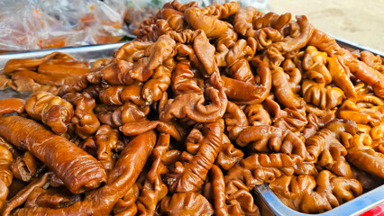 Pile of Pork Chitterlings stew. Thai stewed pork intestines. Braised Pig's Small Intestines & Braised Pork Belly. Galbijjim