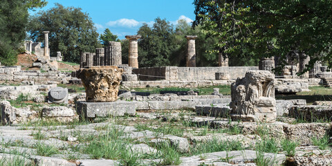 Ancient ruins bask in sunlight. Echoes of Antiquity: Olympia’s Timeless Ruins