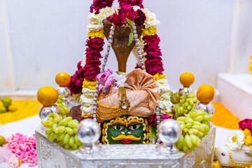 Shivling or shiv lingam decorated with colours and flowers to worship lord shiv. Selective focus.