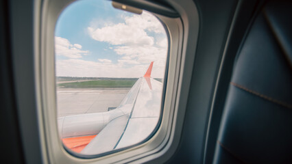 Fototapeta premium view from the airplane window to the blue sky and white clouds