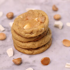 The cookies are golden brown with a slightly crispy edge and a soft, chewy center. Some cookies have chocolate chips