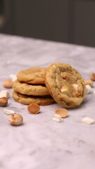 The cookies are golden brown with a slightly crispy edge and a soft, chewy center. Some cookies have chocolate chips