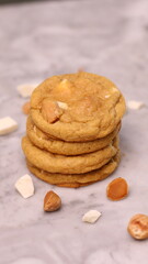 The cookies are golden brown with a slightly crispy edge and a soft, chewy center. Some cookies have chocolate chips