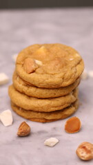 The cookies are golden brown with a slightly crispy edge and a soft, chewy center. Some cookies have chocolate chips