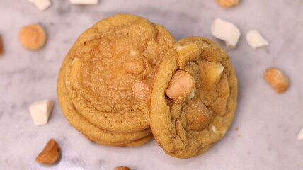 The cookies are golden brown with a slightly crispy edge and a soft, chewy center. Some cookies have chocolate chips