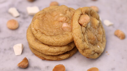 The cookies are golden brown with a slightly crispy edge and a soft, chewy center. Some cookies have chocolate chips