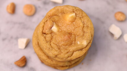 The cookies are golden brown with a slightly crispy edge and a soft, chewy center. Some cookies have chocolate chips