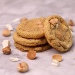 The cookies are golden brown with a slightly crispy edge and a soft, chewy center. Some cookies have chocolate chips