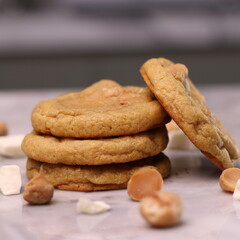 The cookies are golden brown with a slightly crispy edge and a soft, chewy center. Some cookies have chocolate chips