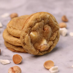 The cookies are golden brown with a slightly crispy edge and a soft, chewy center. Some cookies have chocolate chips