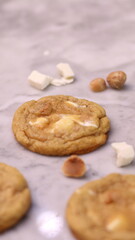 The cookies are golden brown with a slightly crispy edge and a soft, chewy center. Some cookies have chocolate chips