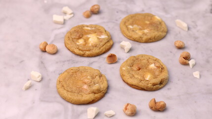 The cookies are golden brown with a slightly crispy edge and a soft, chewy center. Some cookies have chocolate chips