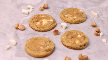 The cookies are golden brown with a slightly crispy edge and a soft, chewy center. Some cookies have chocolate chips