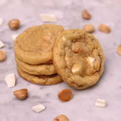 The cookies are golden brown with a slightly crispy edge and a soft, chewy center. Some cookies have chocolate chips