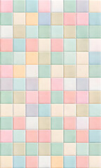 Fototapeta premium Pastel Checkerboard Chic: A seamless pattern of soft pink, blue, and yellow squares forms a delightful and versatile background. 