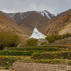 An artificially created ice stupa or artificial glacier in Leh Ladakh, India.
