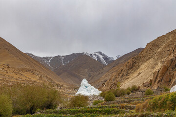 An artificially created ice stupa or artificial glacier in Leh Ladakh, India. 