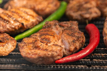 grilled steak with papers jalapeño and chili pepper