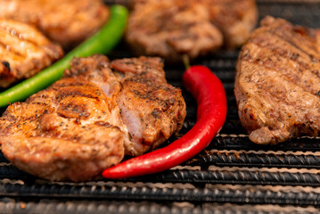 grilled steak with papers jalapeño and chili pepper