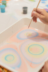 Classes in painting on water with colored paints
