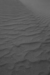 Obraz premium Abstract pattern made due to wind erosion on shifting sand dunes.