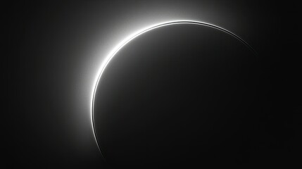 A sleek black wallpaper featuring a smooth gradient that subtly suggests the edge of a solar eclipse, with a soft horizon glow.